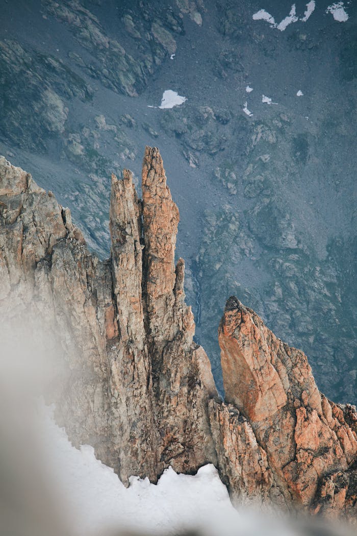 A person is standing on top of a mountain