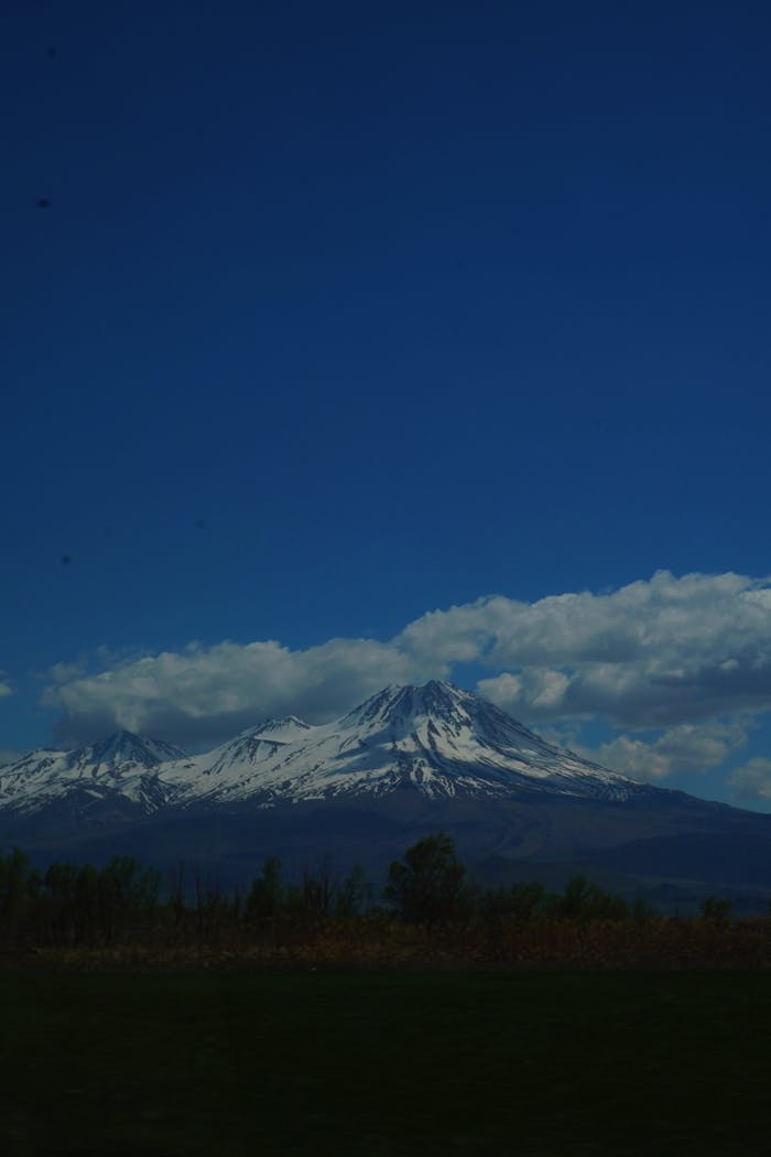 A view of a mountain with snow on it